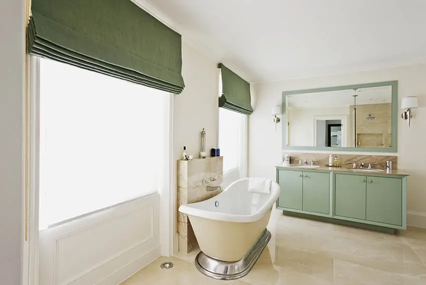 Roman shades in bathroom with freestanding tub