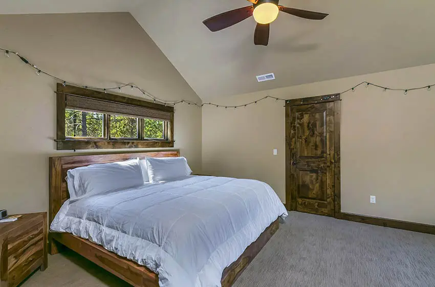 Upstairs guest bedroom with solid wood furniture window frames doors