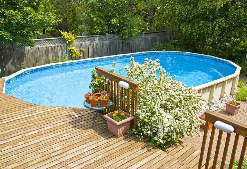 Above ground pool with wood deck