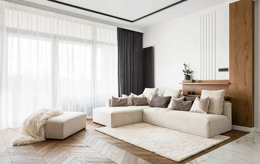 Living room with corner sofa and ottoman