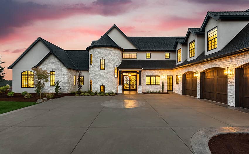 Luxury house with poured concrete driveway and circular inlay design