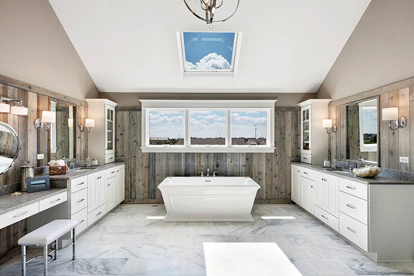 Master bathroom with skylight wood accent wall freestanding tub