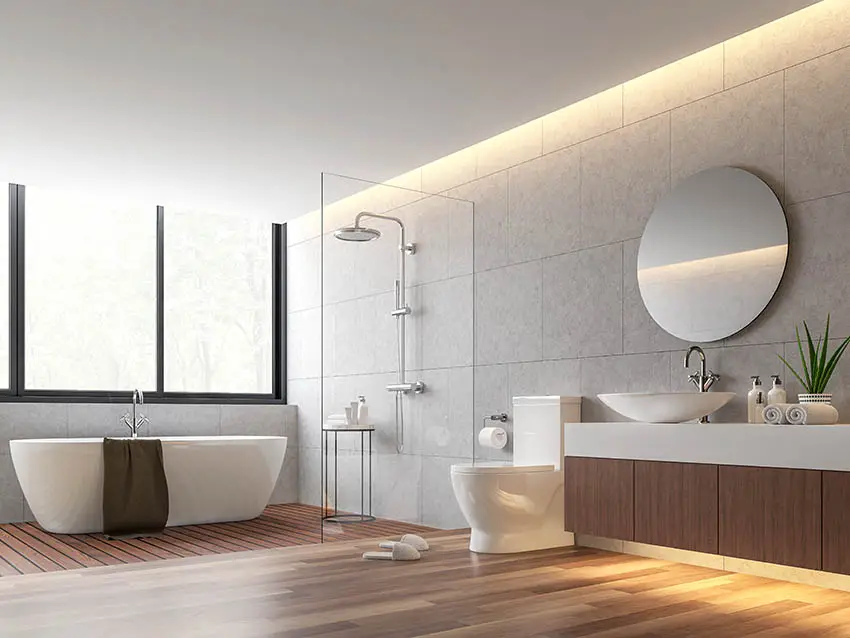 Modern bathroom with wet room shower with teak floors and freestanding tub