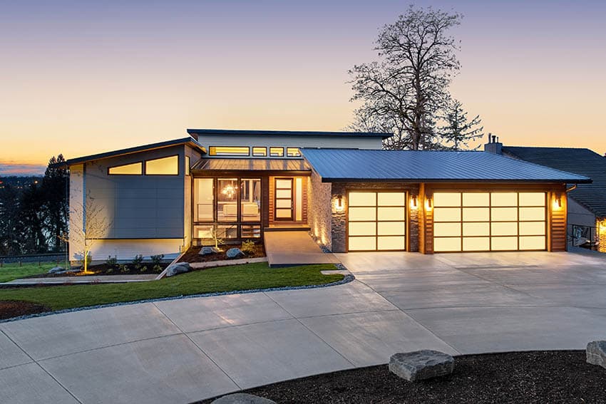 Modern home with curved concrete driveway