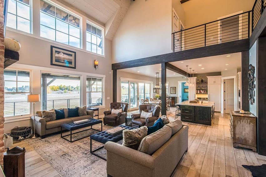 Open concept living room with vaulted ceiling wood flooring
