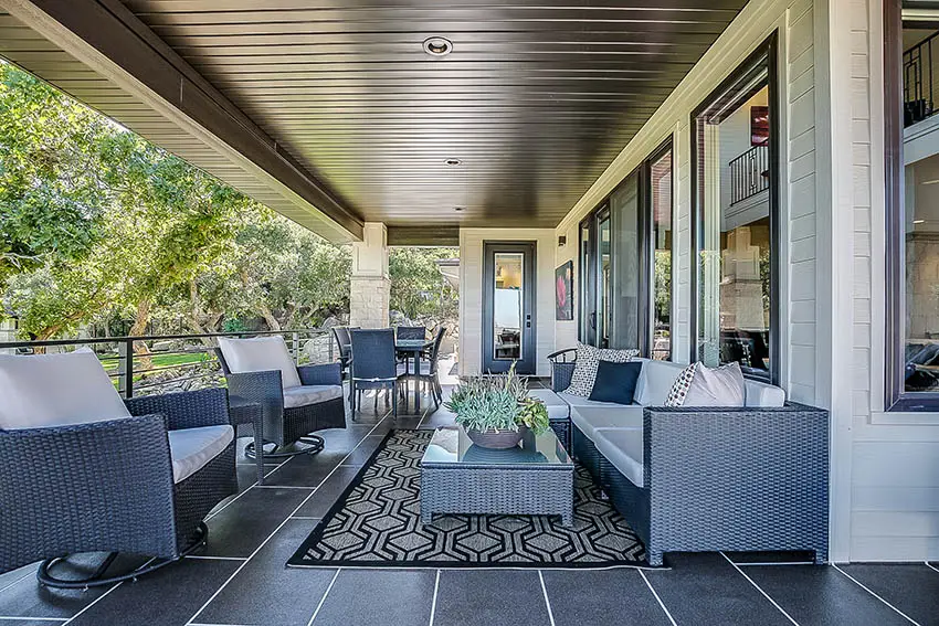 Outdoor charcoal porcelain tile covered patio