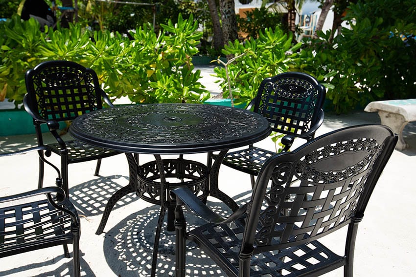 Outdoor patio with black ecoating steel dining table chairs