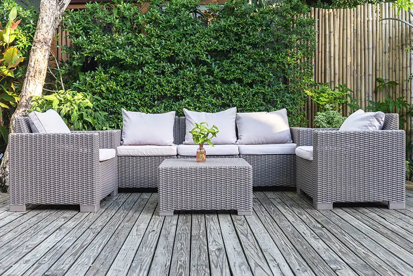 Faux wicker outdoor furniture on wood deck