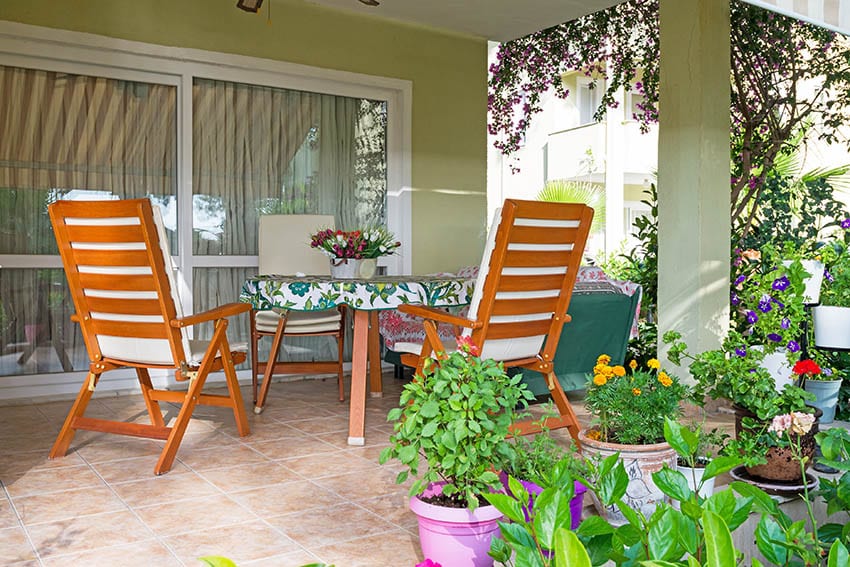 Teak wood garden table and chairs on outdoor patio