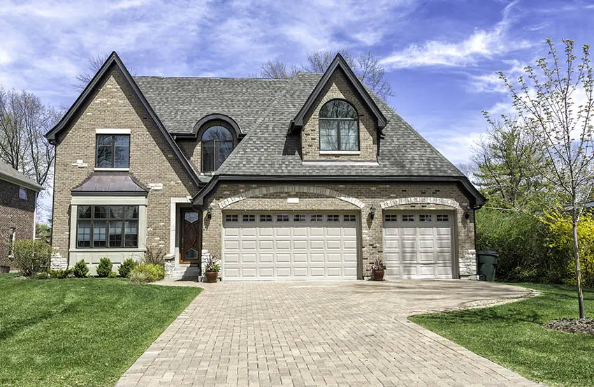 Traditional house with paver driveway large garage