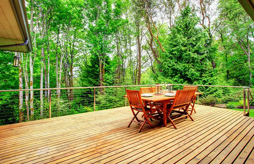 Deck with outdoor furniture and forest views