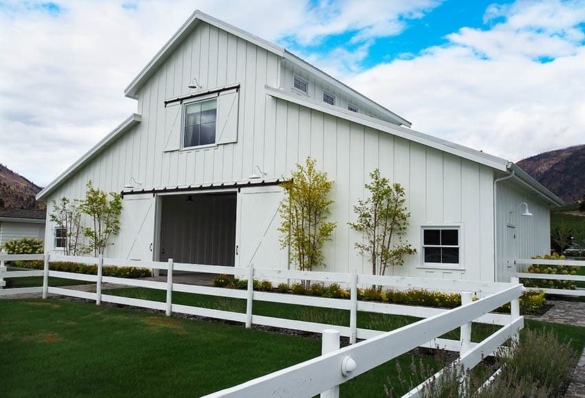 Barn home kit with 2 story white siding