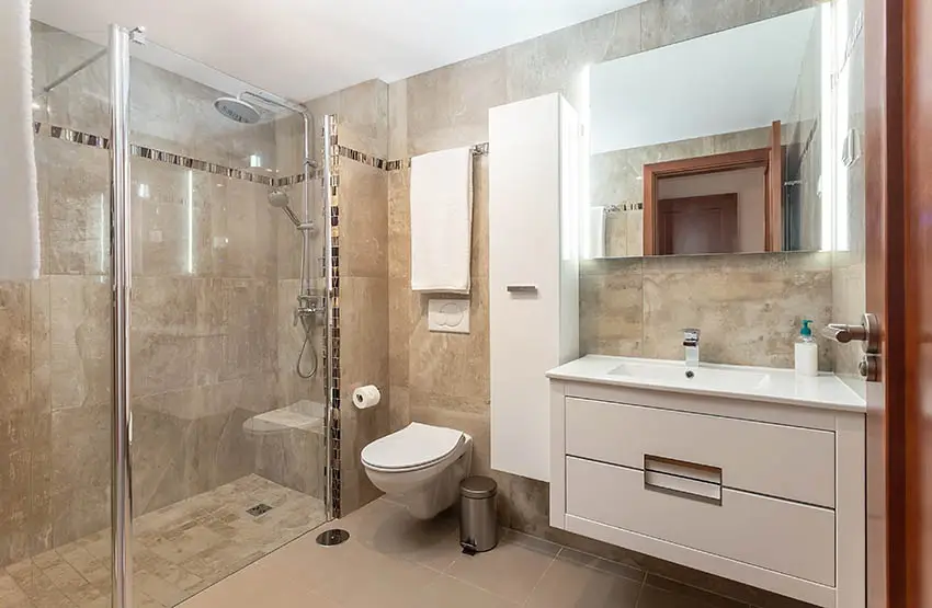 Bathroom with beige cultured marble shower surround walls