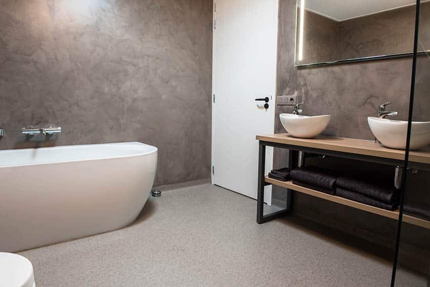 Bathroom with terrazzo floor, bath tub and 2 sinks