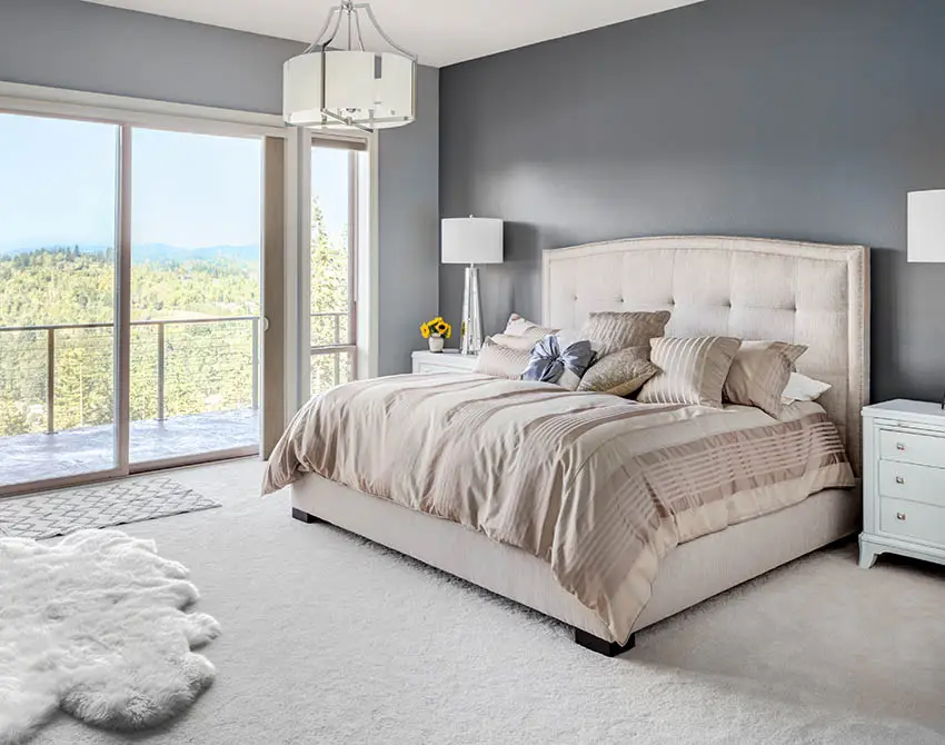 Bedroom with nylon carpet gray painted walls