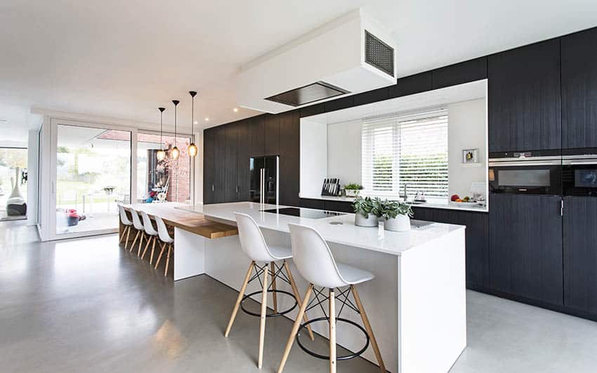 Black white minimalist kitchen with polished concrete floors