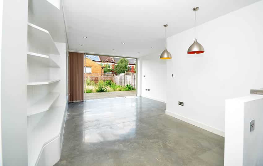 Condo home with pendant lights, open shelves and sliding door