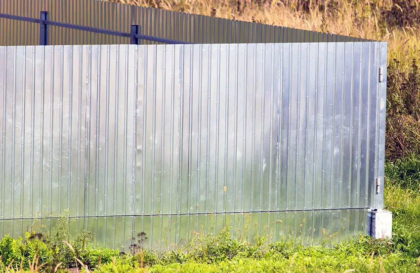 Corrugated aluminum fence