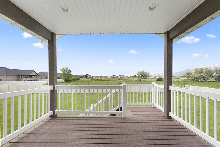 Covered composite deck with white railing