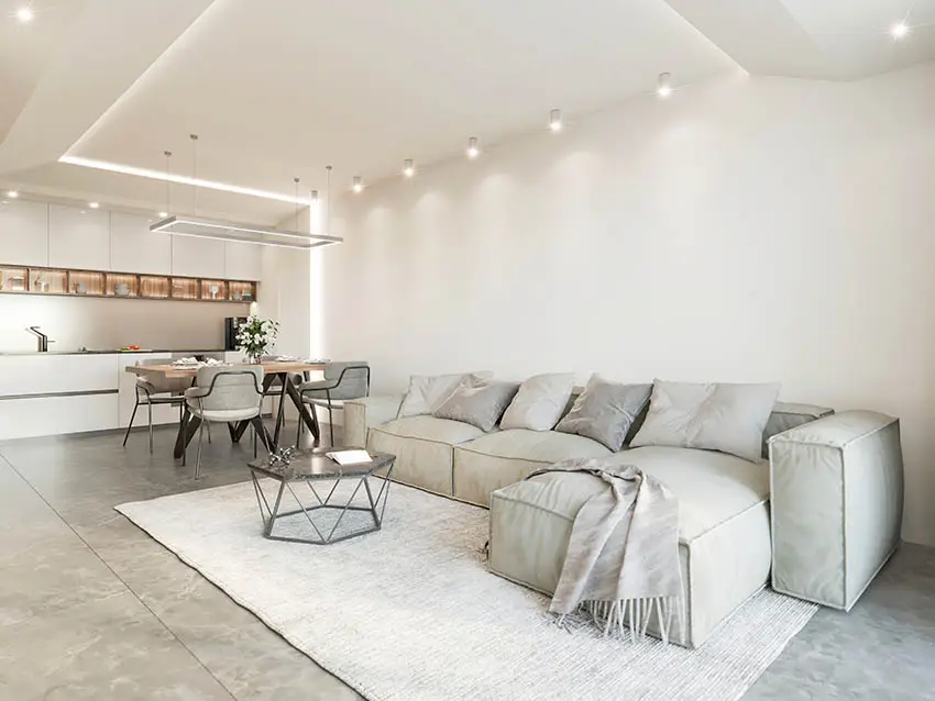 Garage man cave conversion with polished concrete floors downlights kitchen sectional sofa