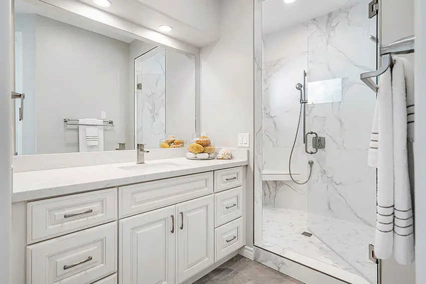 Guest bathroom with cultured marble shower vanity white cabinet