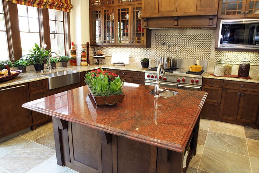 Kitchen with beige granite countertops and high grade red granite island solid wood countertops