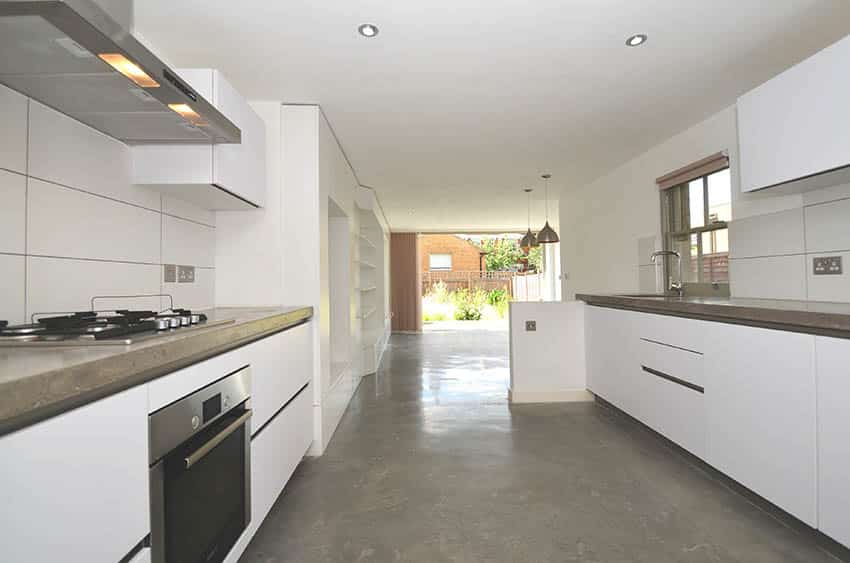 Modern galley kitchen with grind and seal floors