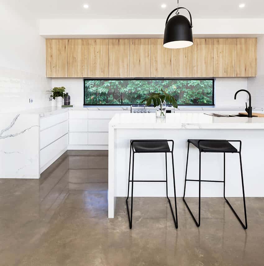 Kitchen with waterfall counter, Calcatta marble and white cabinets