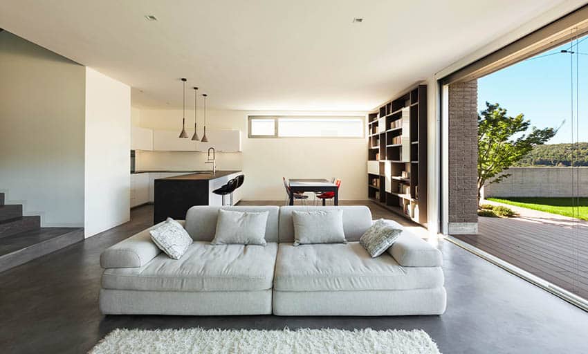 Living room with view of counter bar, table and built-in bookshelf