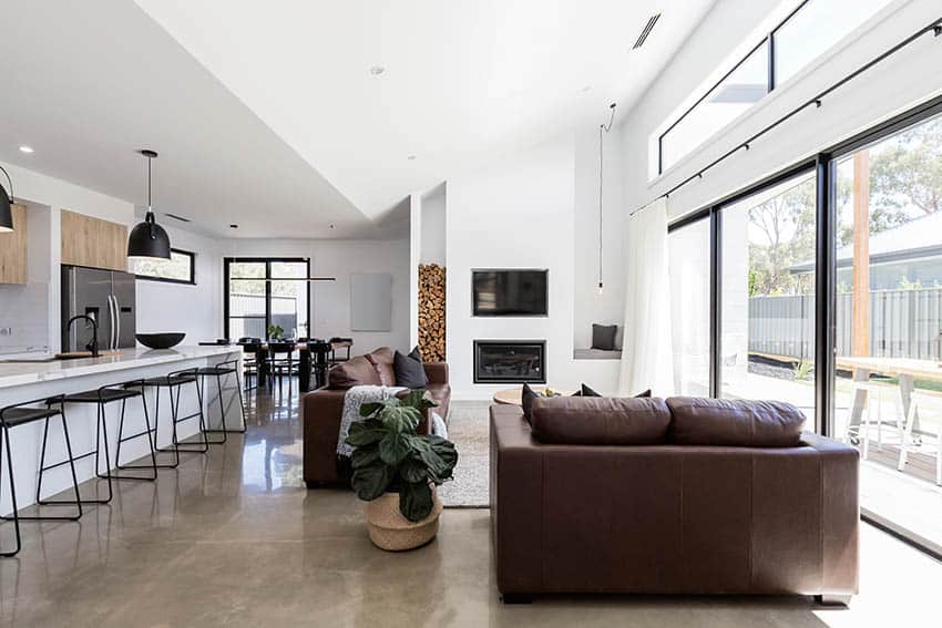 Modern room with leather sofa and black brown stools