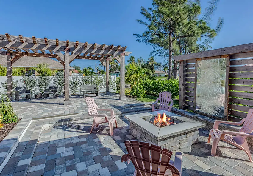 Paver patio with stone fire pit water feature