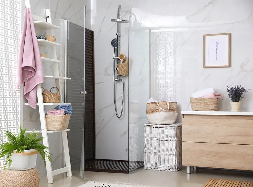 Small bathroom with cultured marble shower enclosure and walls