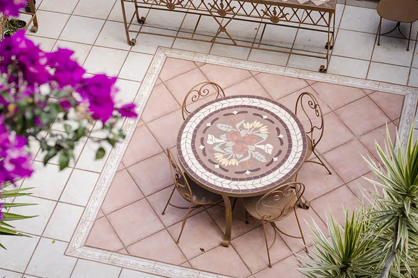 spanish style patio with light pink ceramic tiles