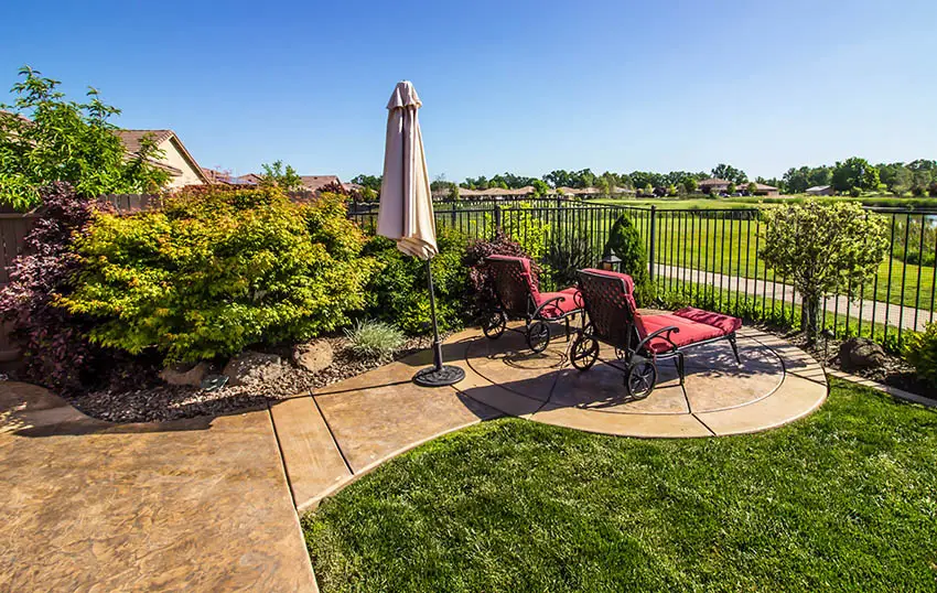 Patio with circular sitting area and outdoor furniture