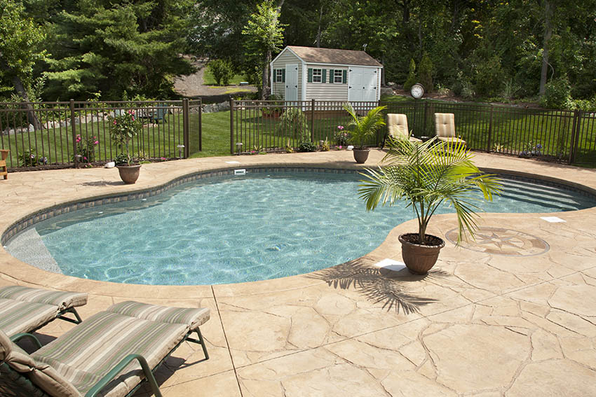 Stamped concrete patio around swimming pool