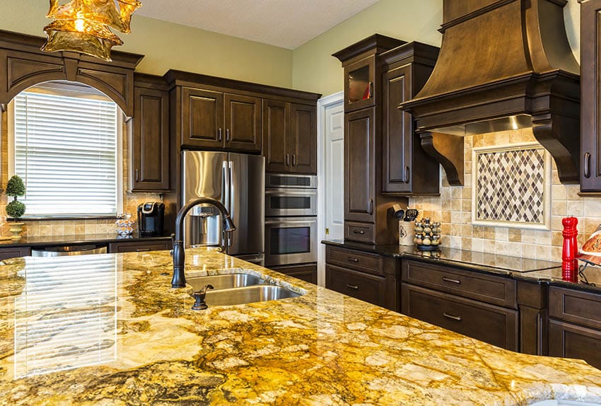 Traditional kitchen with golden granite countertop island dark granite countertops solid wood cabinets