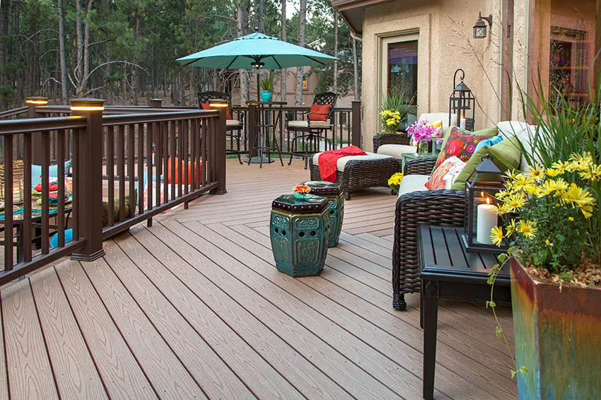 Wood look composite deck with dark color railing