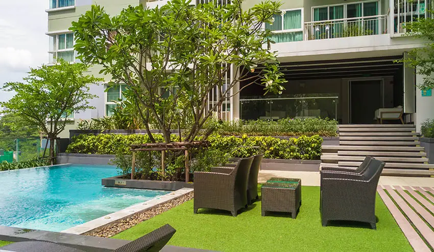 Artificial grass pool patio with sitting area