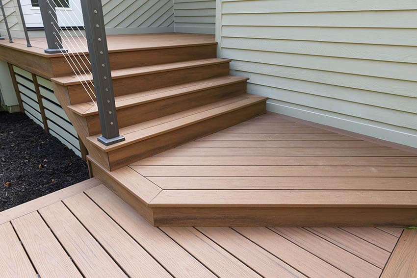 Azek decking steps to house with modern railing