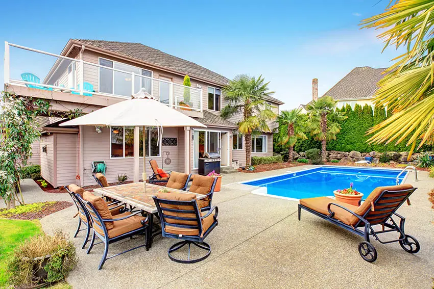 Backyard pool with exposed aggregate deck