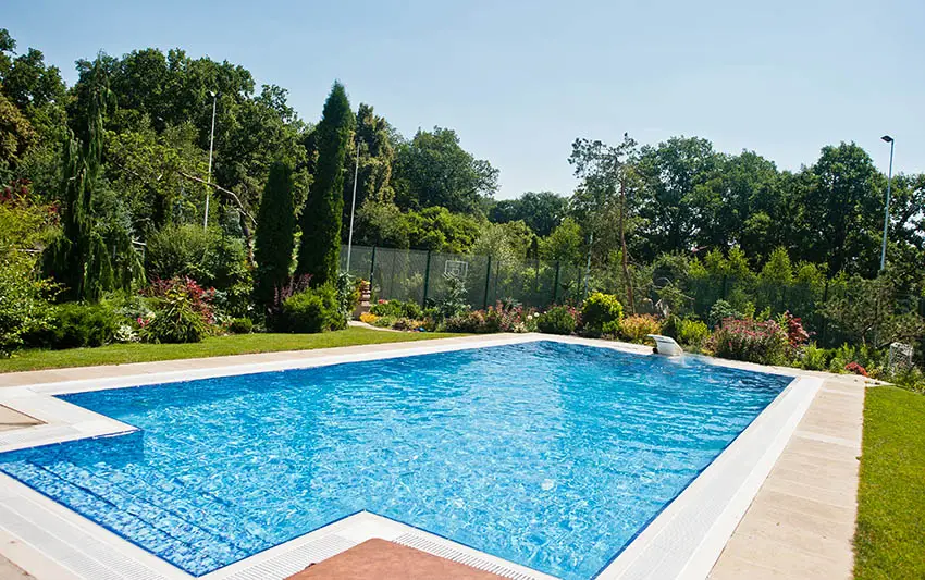 Beautiful blue chlorine swimming pool with rectangular design front entry steps