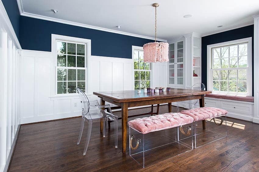 Dining room with wooden table, pink drum chandelier and benches