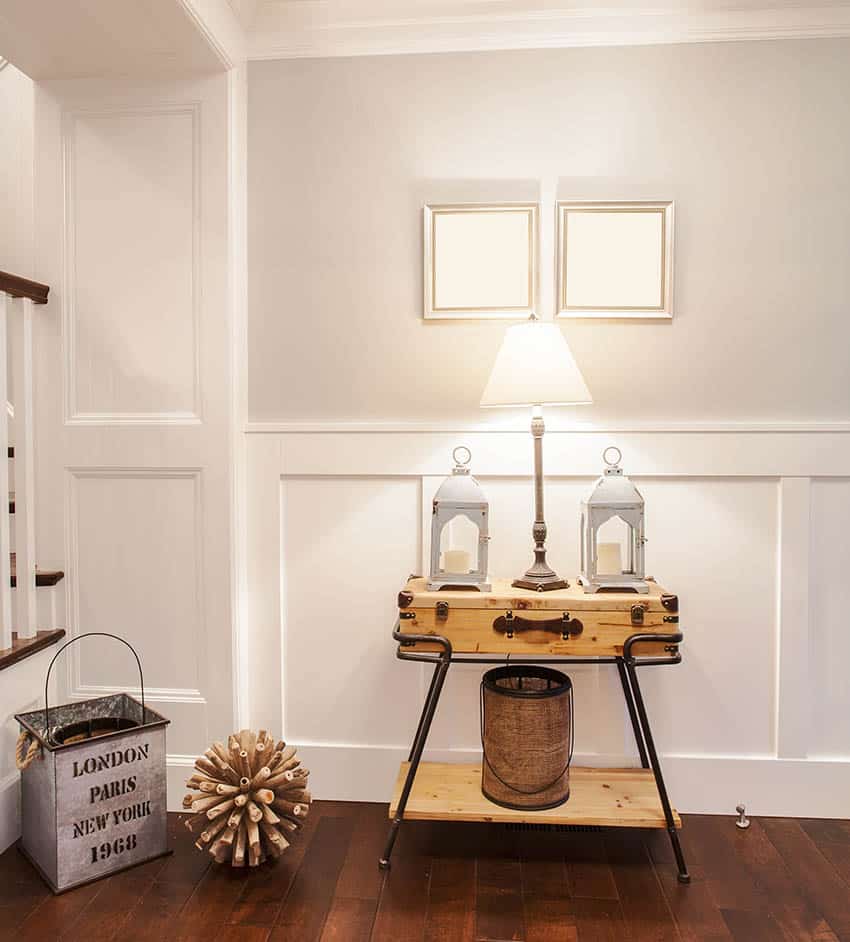 Hallway with wainscoting, vintage table with table lamp