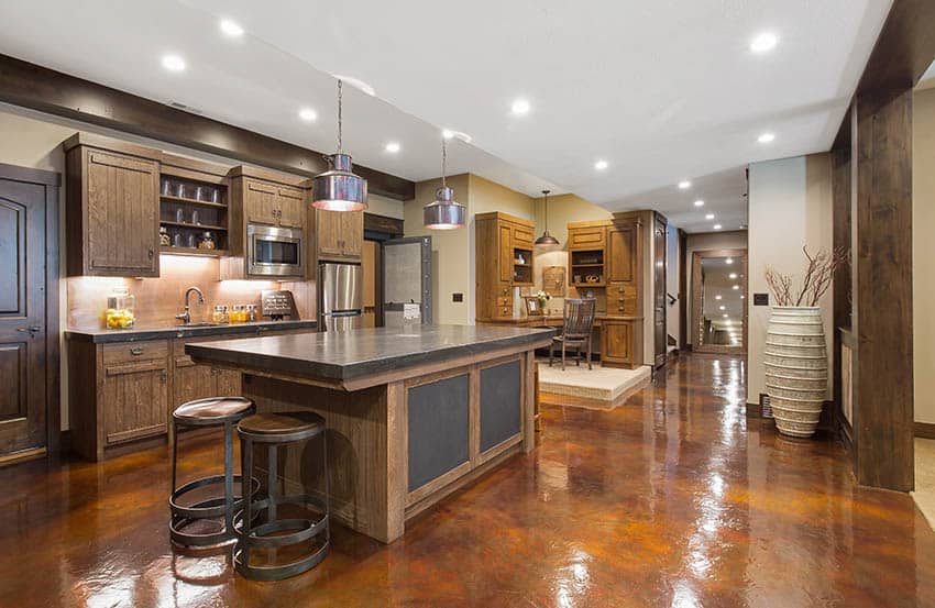 Kitchen with color stained concrete floors and custom wood cabinetry