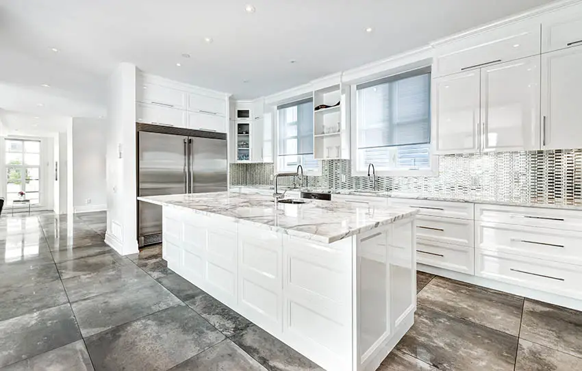 Kitchen with white painted high gloss cabinets quartz countertops polished concrete countertops 
