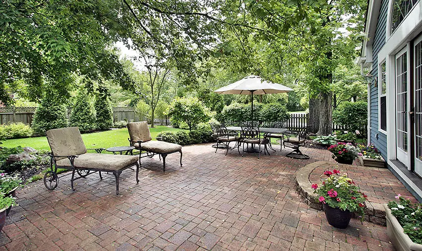 Large backyard paver patio with sealed coating application