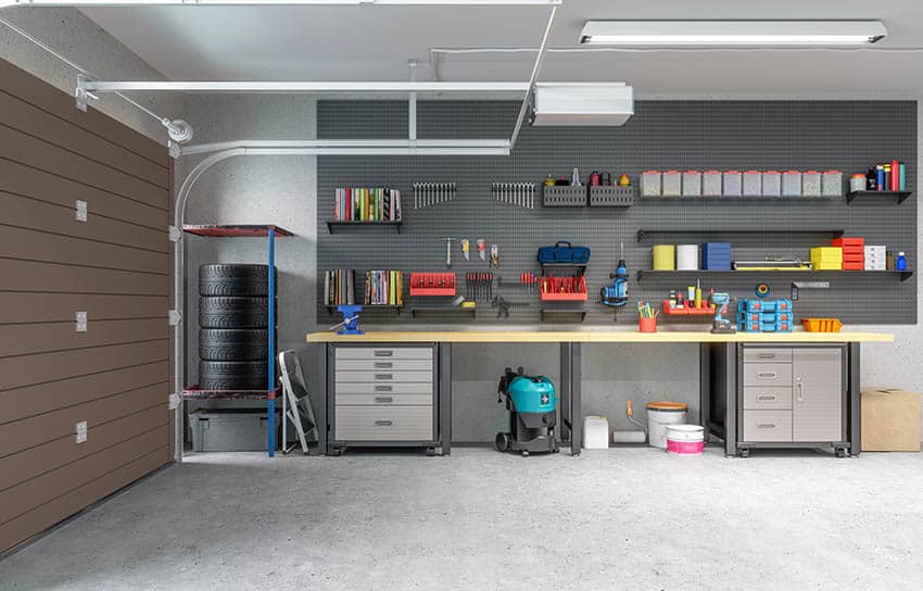 Minimalist garage with long work bench tool box and pegboard tool storage