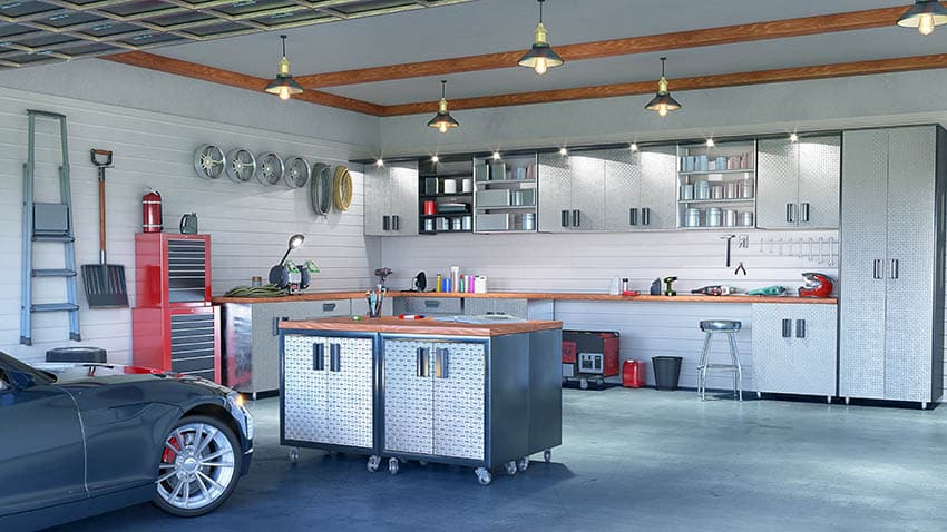 Minimalist garage with stainless storage cabinets workbench island