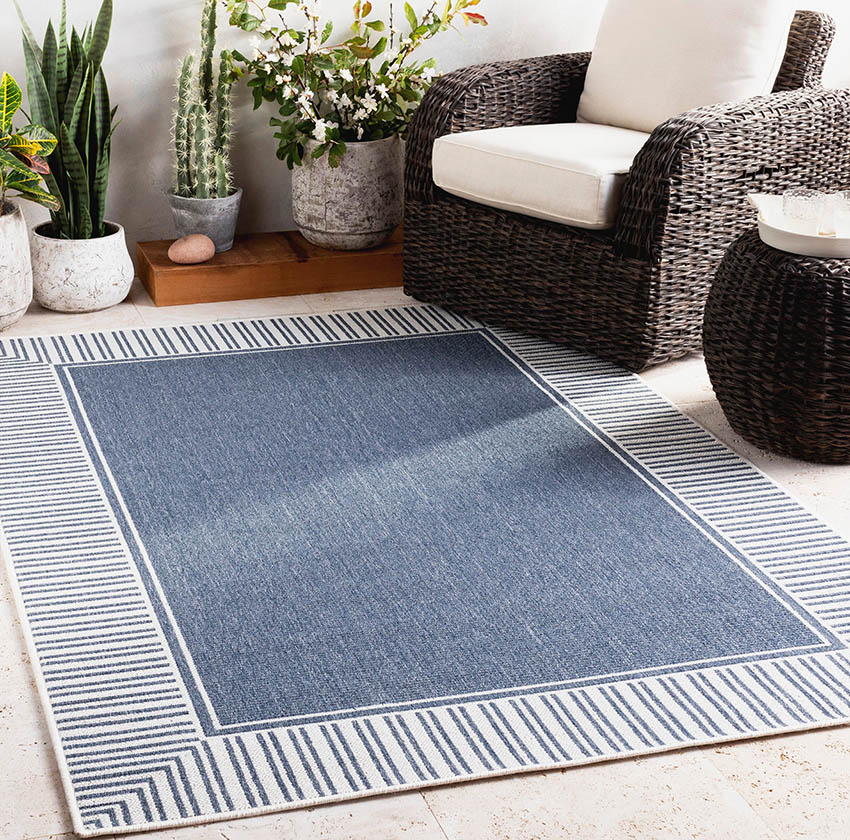 Plastic wood likk rattan chair and rug with blue and white colors