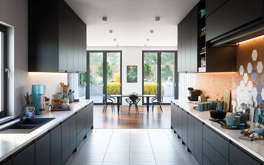 Modern galley kitchen with black silgranit sink black cabinets tile flooring